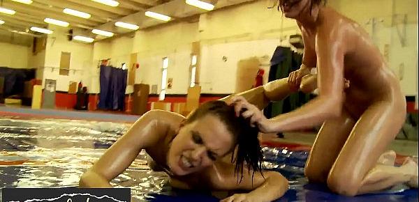 Lesbian babes in bikini wrestling while oiled